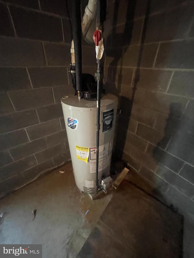 utility room featuring gas water heater