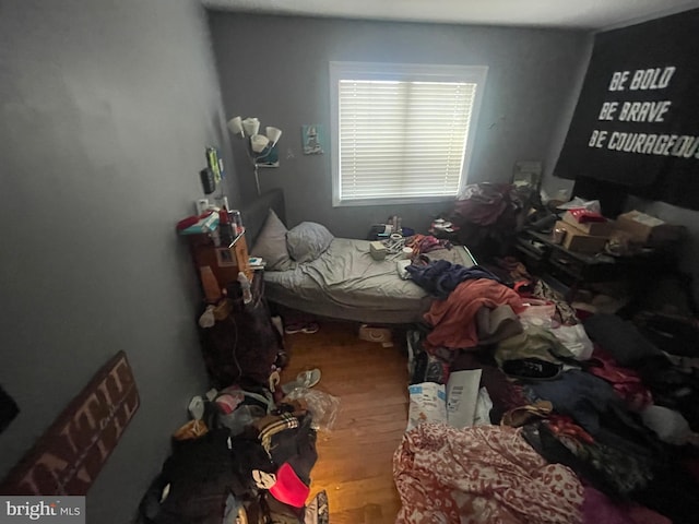 bedroom with wood finished floors