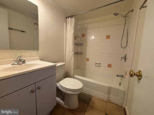 bathroom featuring toilet, tile patterned flooring, shower / bath combo with shower curtain, and vanity