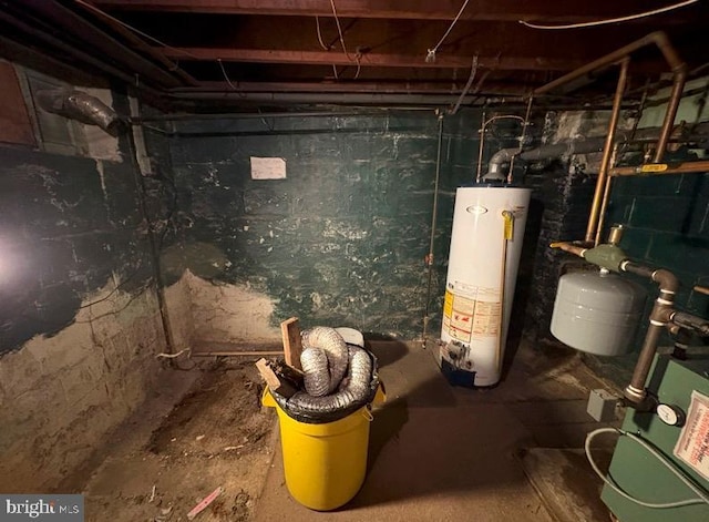 utility room featuring water heater