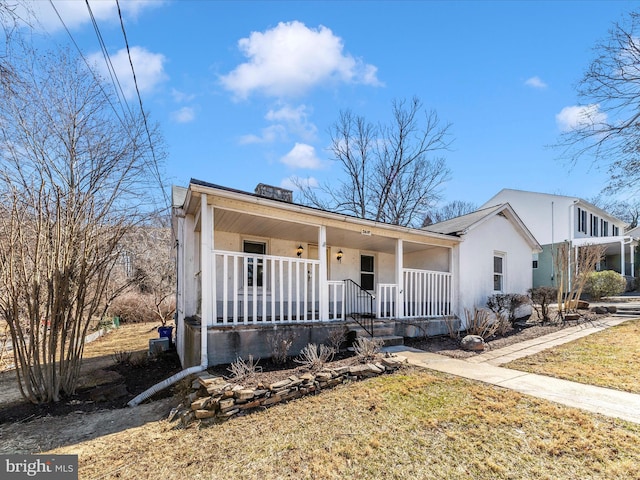 ranch-style home with covered porch and stucco siding