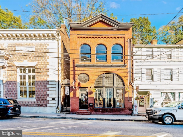 view of front of house featuring brick siding