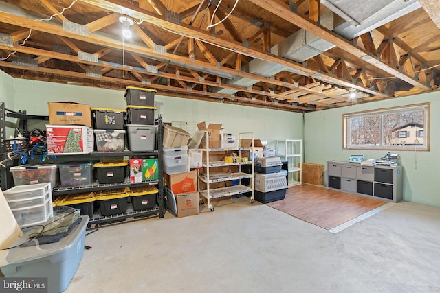 below grade area featuring a garage and concrete block wall