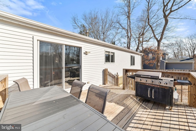 deck with outdoor dining area