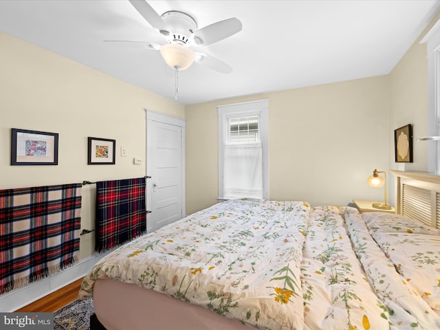 bedroom featuring ceiling fan and wood finished floors