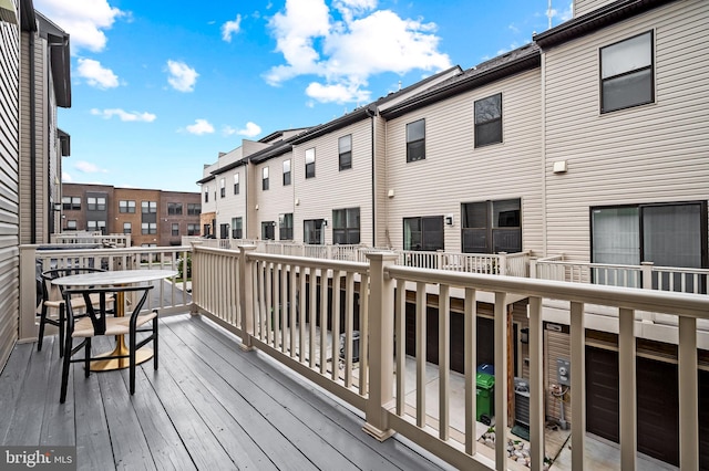 wooden terrace featuring a residential view