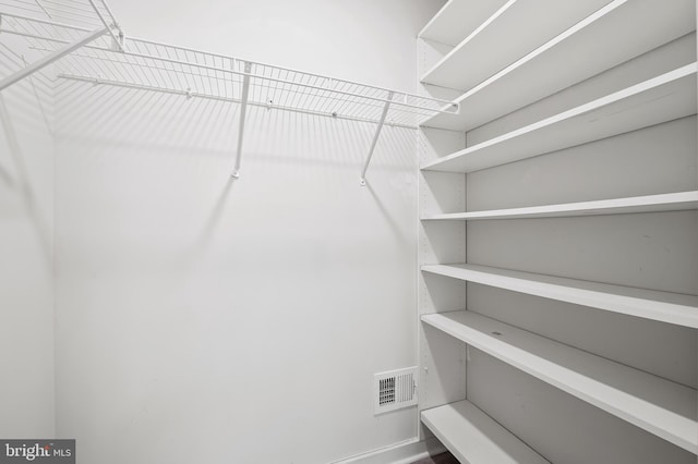 walk in closet featuring visible vents