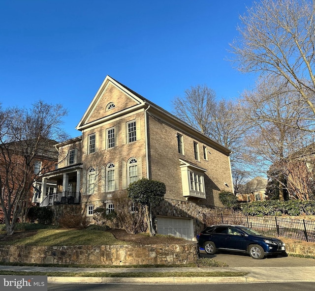 view of front of house with fence