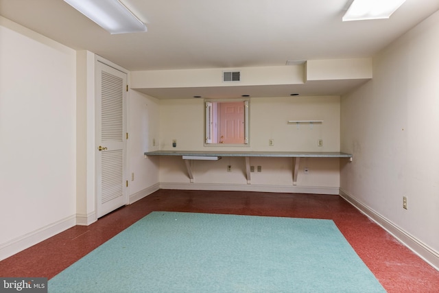 interior space featuring baseboards and visible vents