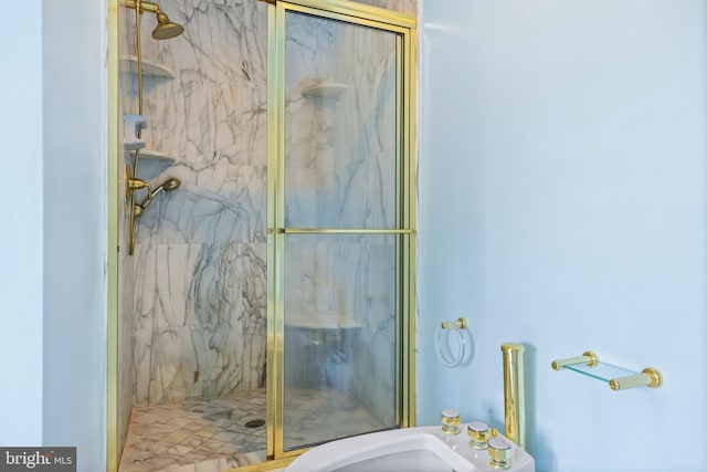 full bathroom with a marble finish shower