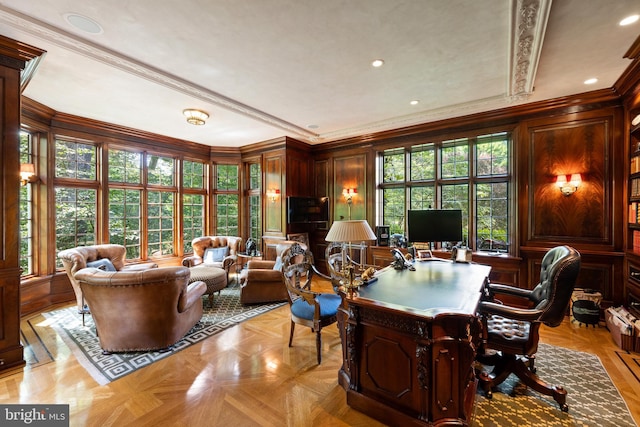 office space featuring wood walls, a decorative wall, crown molding, and recessed lighting