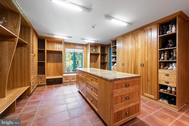 spacious closet featuring tile patterned floors