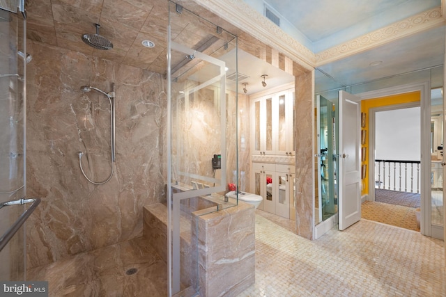 bathroom with visible vents, vanity, and a marble finish shower