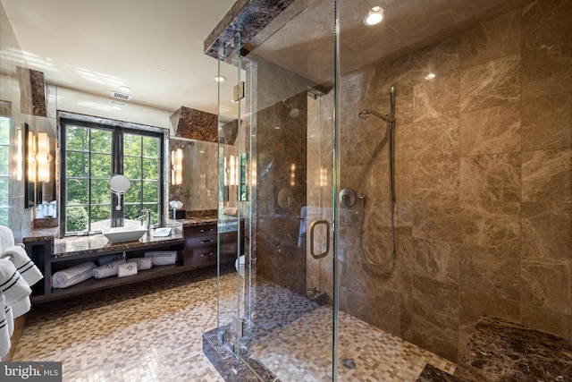 full bathroom featuring a stall shower and vanity