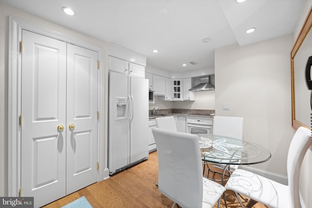 dining room featuring light wood-style floors and recessed lighting