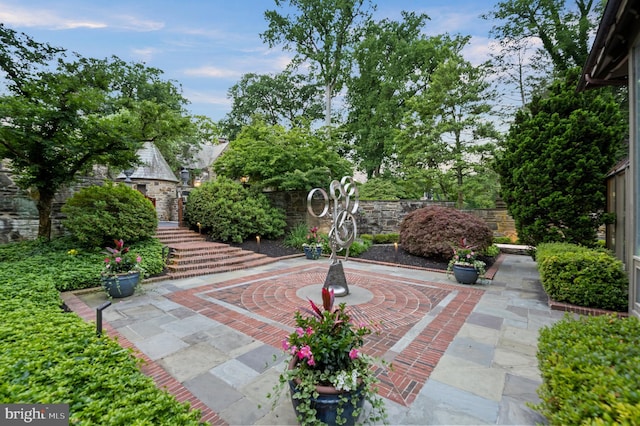 surrounding community with a patio area and fence