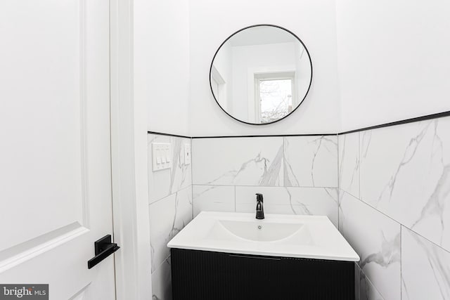 bathroom with tile walls and vanity