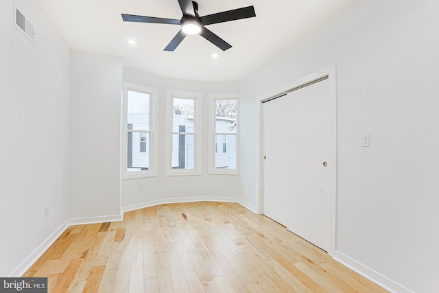 unfurnished room featuring recessed lighting, a ceiling fan, baseboards, visible vents, and light wood-style floors