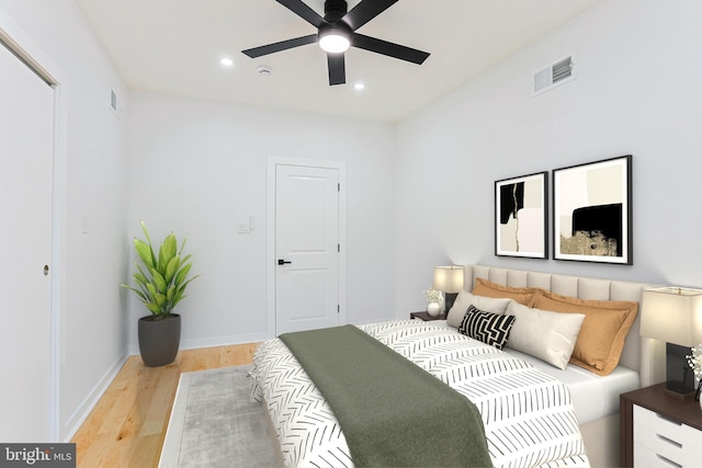 bedroom featuring baseboards, light wood-type flooring, visible vents, and recessed lighting