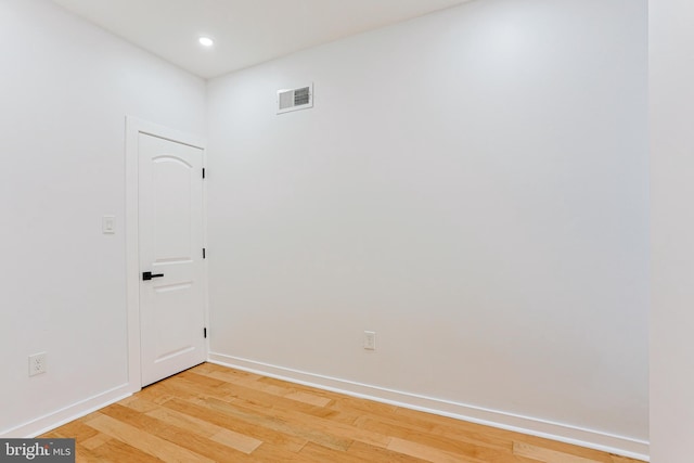 spare room with visible vents, recessed lighting, light wood-style flooring, and baseboards