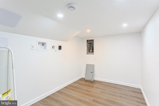 clothes washing area featuring washer hookup, recessed lighting, light wood-style flooring, and baseboards