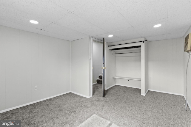 unfurnished bedroom with recessed lighting, carpet flooring, a drop ceiling, and baseboards