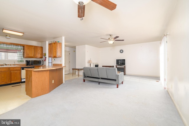 living room with light colored carpet, baseboards, and a ceiling fan