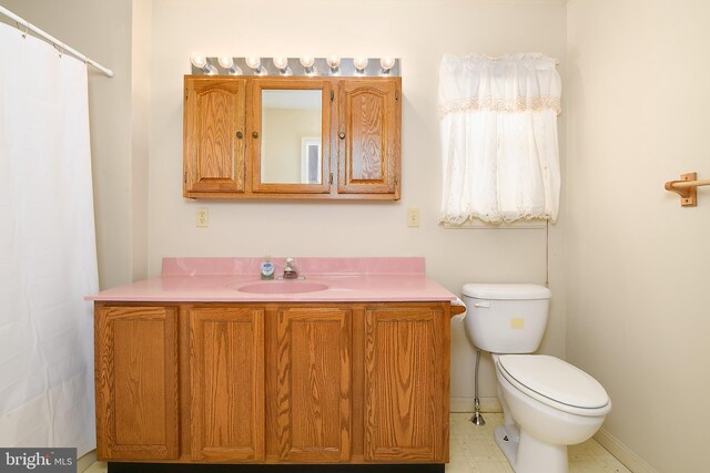 full bath with vanity and toilet