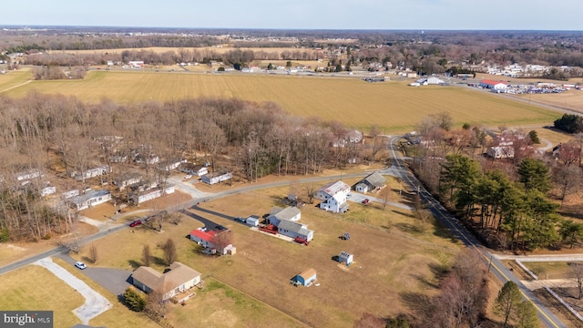 birds eye view of property featuring a rural view