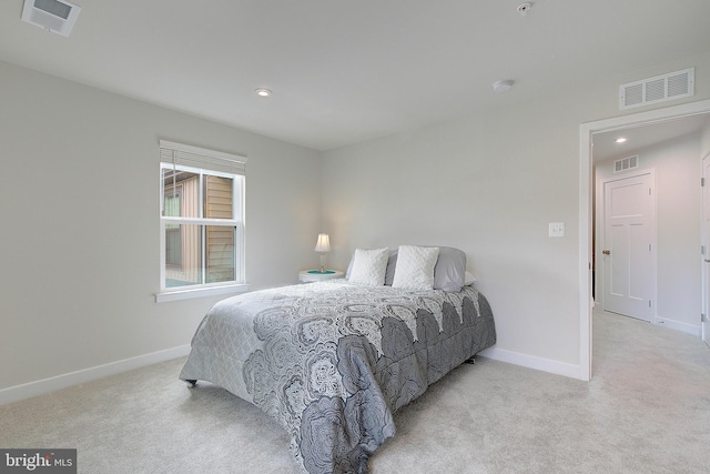 carpeted bedroom with recessed lighting, visible vents, and baseboards