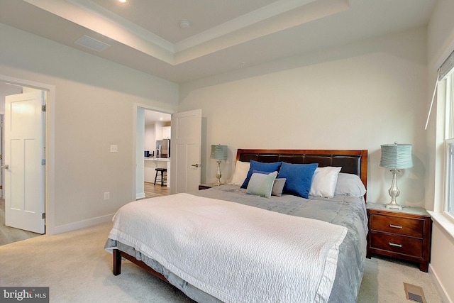 bedroom featuring light carpet, a raised ceiling, visible vents, and stainless steel fridge with ice dispenser