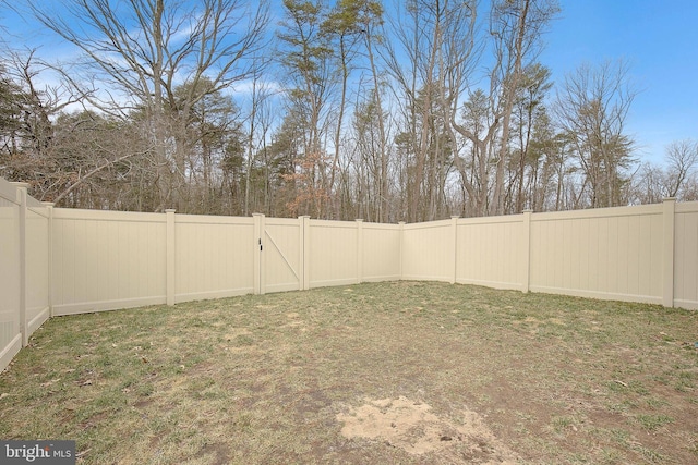 view of yard with a fenced backyard