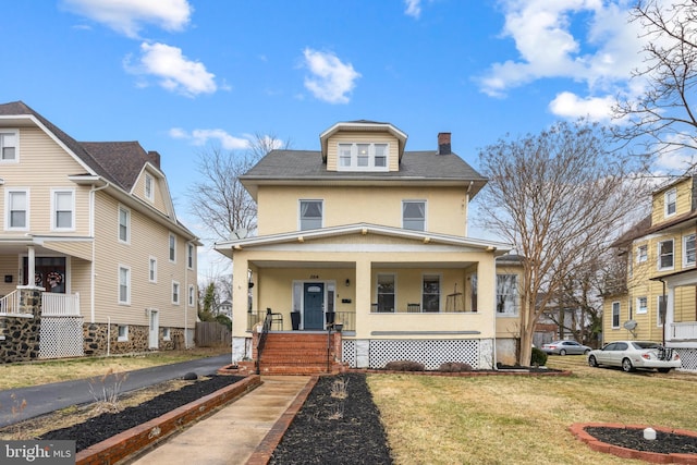 traditional style home with a porch, a front lawn, a chimney, and stucco siding