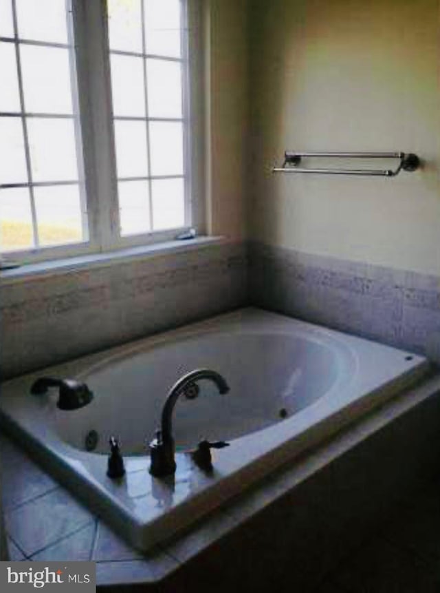 bathroom with a whirlpool tub