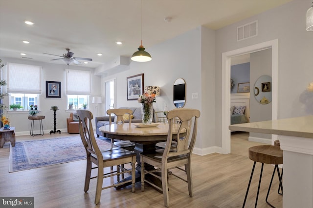 dining space featuring recessed lighting, visible vents, light wood-style flooring, and baseboards