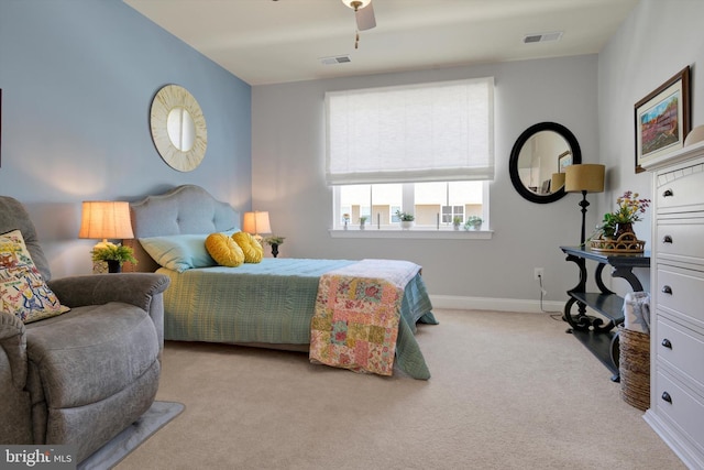 carpeted bedroom featuring baseboards, visible vents, and a ceiling fan