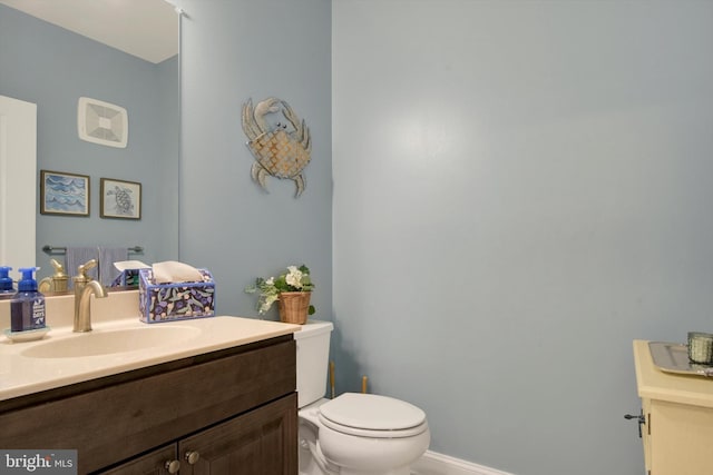 half bath with vanity and toilet