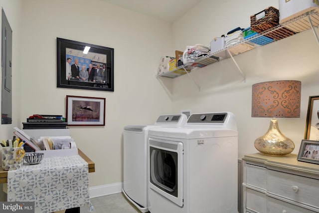 washroom featuring laundry area, independent washer and dryer, and baseboards