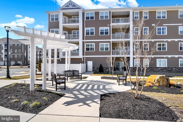 view of home's community with a pergola