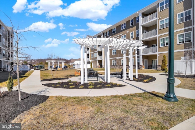 view of community featuring a residential view and a pergola