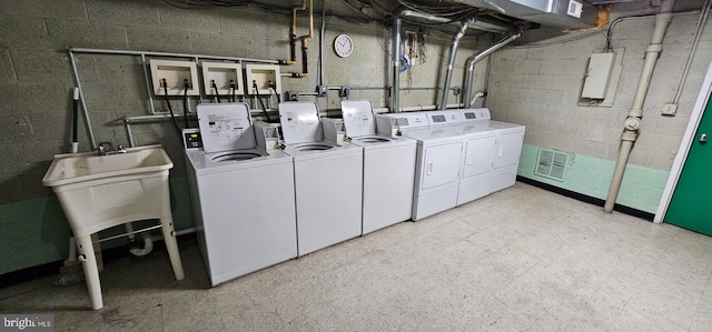 washroom with laundry area, visible vents, washer and clothes dryer, and light floors