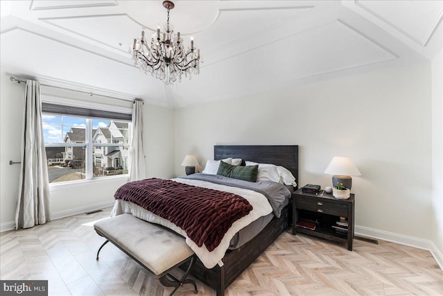 bedroom with visible vents, a notable chandelier, and baseboards