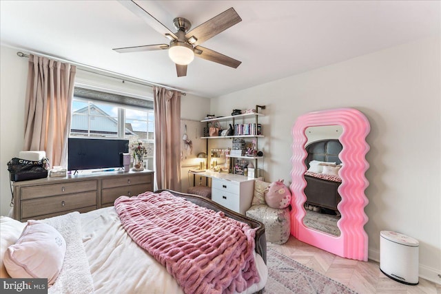 bedroom featuring ceiling fan and baseboards