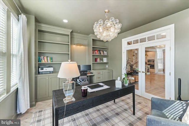 office with french doors, recessed lighting, and an inviting chandelier