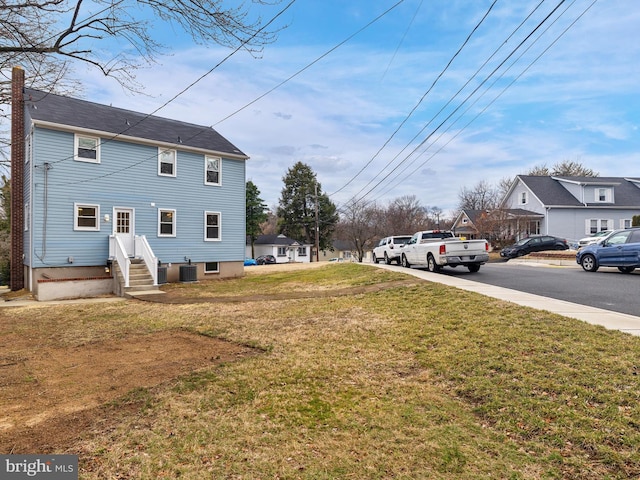 view of yard with central AC