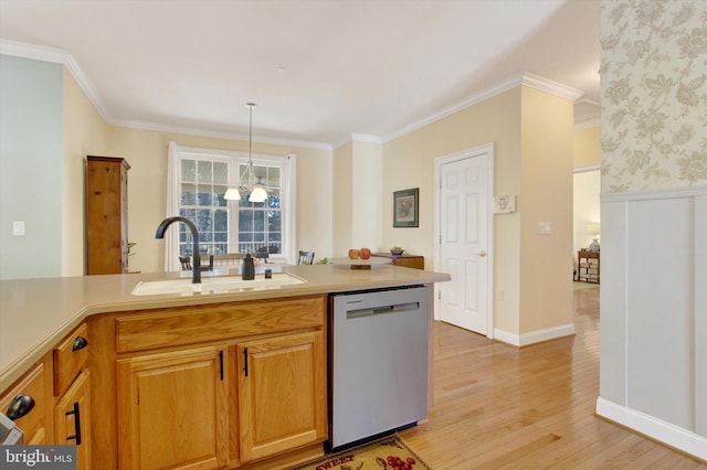 kitchen with light countertops, crown molding, light wood-type flooring, stainless steel dishwasher, and a sink