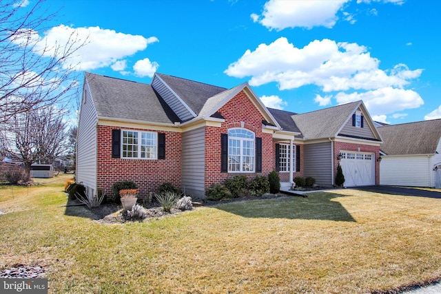 view of front of house featuring an attached garage, roof with shingles, a front lawn, and brick siding