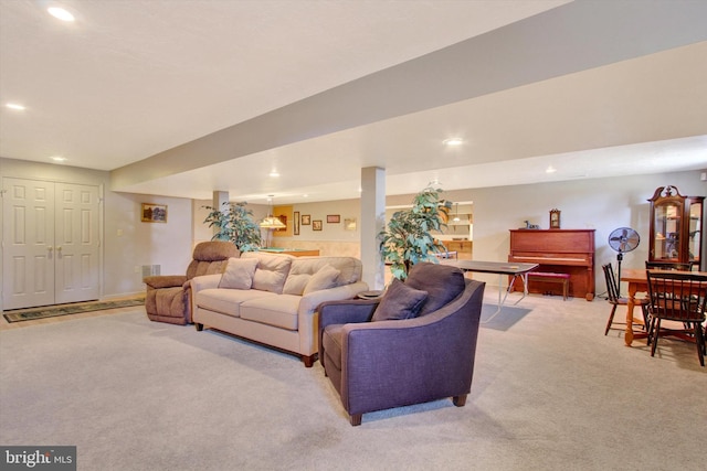 living room with recessed lighting and light colored carpet