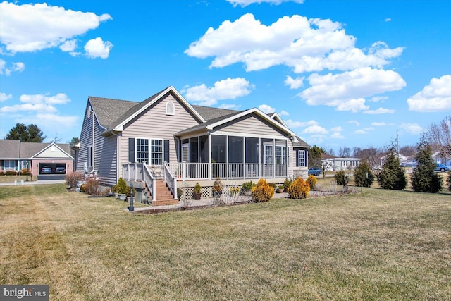 exterior space featuring a sunroom and a front lawn