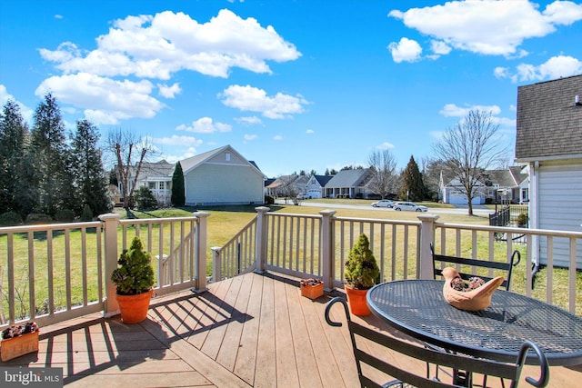 wooden terrace with a yard and a residential view